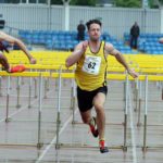 David Feeney (Amber Valley) wins the senior 110 metres hurdles.