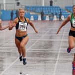 Annabelle Lewis (Kingston Upon Hull) wins the senior womens 100 metres from 343 Katy Wyper (Blackpool Wyre and Fylde) and Rebecca Campsall (City of York).