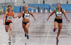 Annabelle Lewis (Kingston Upon Hull) wins the senior womens 100 metres from 343 Katy Wyper (Blackpool Wyre and Fylde) and Rebecca Campsall (City of York).