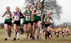 Leaders of the womens junior race, 49 Francesca Brint, eventual winner, 53 Juliet Downs, 51 Claudia Cowen (all Sale Harriers Manchester), and 8 Becky Briggs (City of Hull), 2018 Northern Cross Country Champs., Harewood House, Leeds. Photo: David T. Hewitson/Sports for All Pics