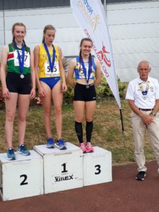 Under 20s women triple jump, 1st Holly Smith, 2nd Rebecca Keen, 3rd Grace Plater with Kevin Carr
